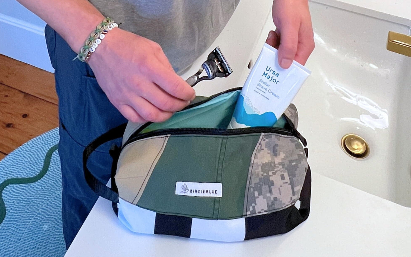 A lifestyle photo close up of the BirdieBlue Traveler with shaving cream and razor in it