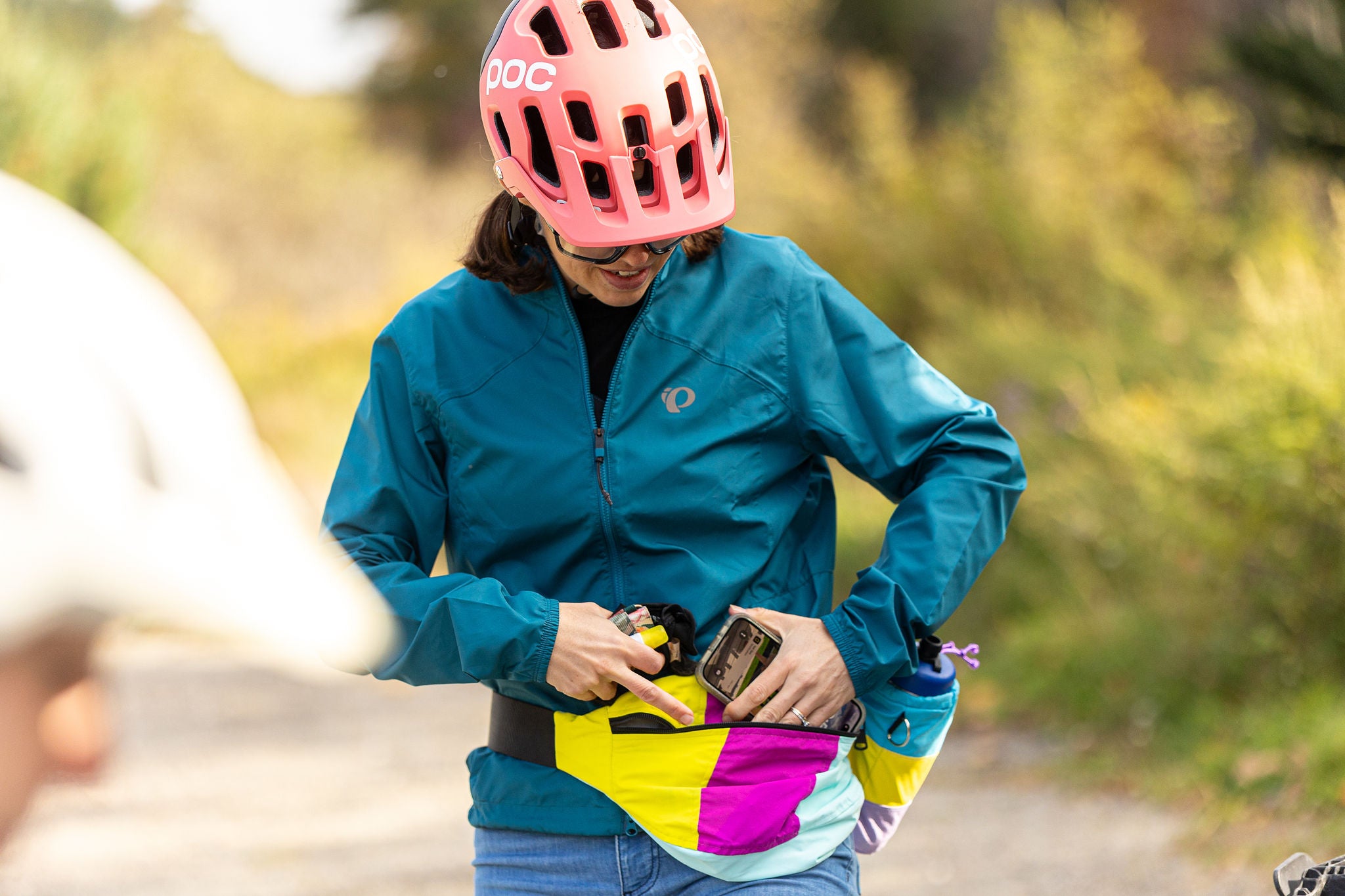 the fanny, wearing a helmet and holding phone lifestyle