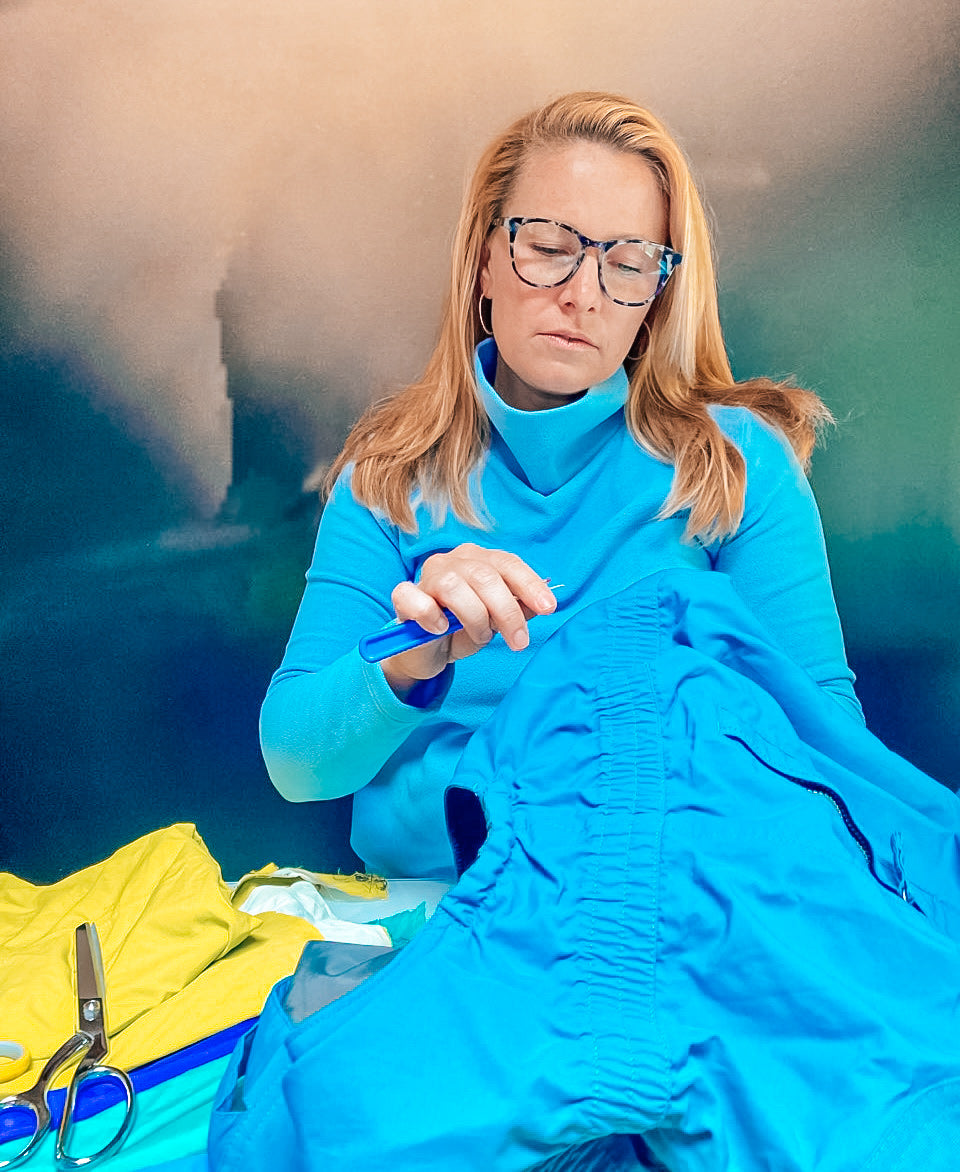 Kate Harvey taking apart old ski apparel to be turned into bags
