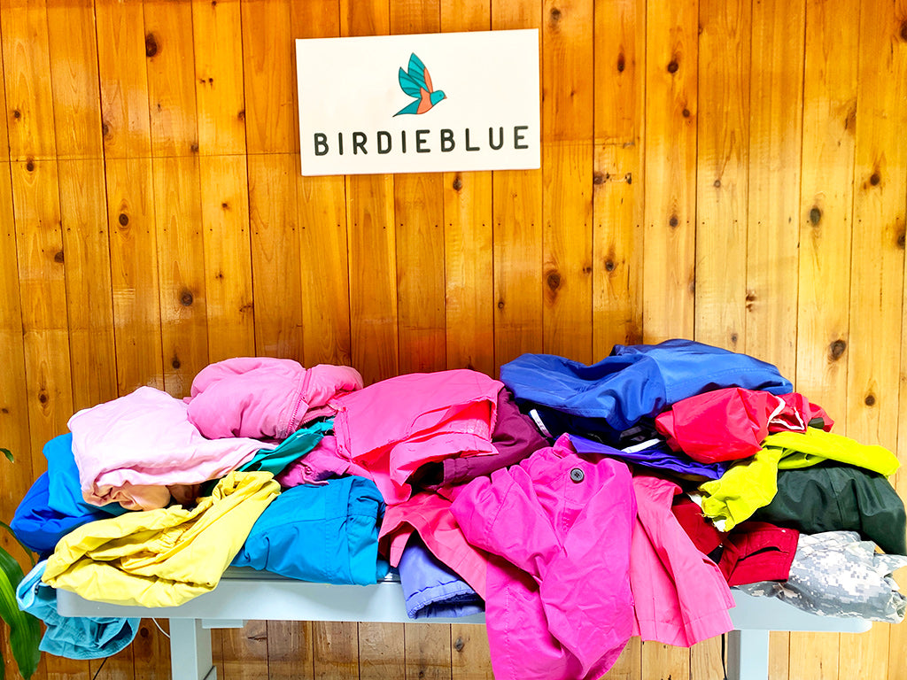 Pile of old ski clothing to be recycled and turned into bags
