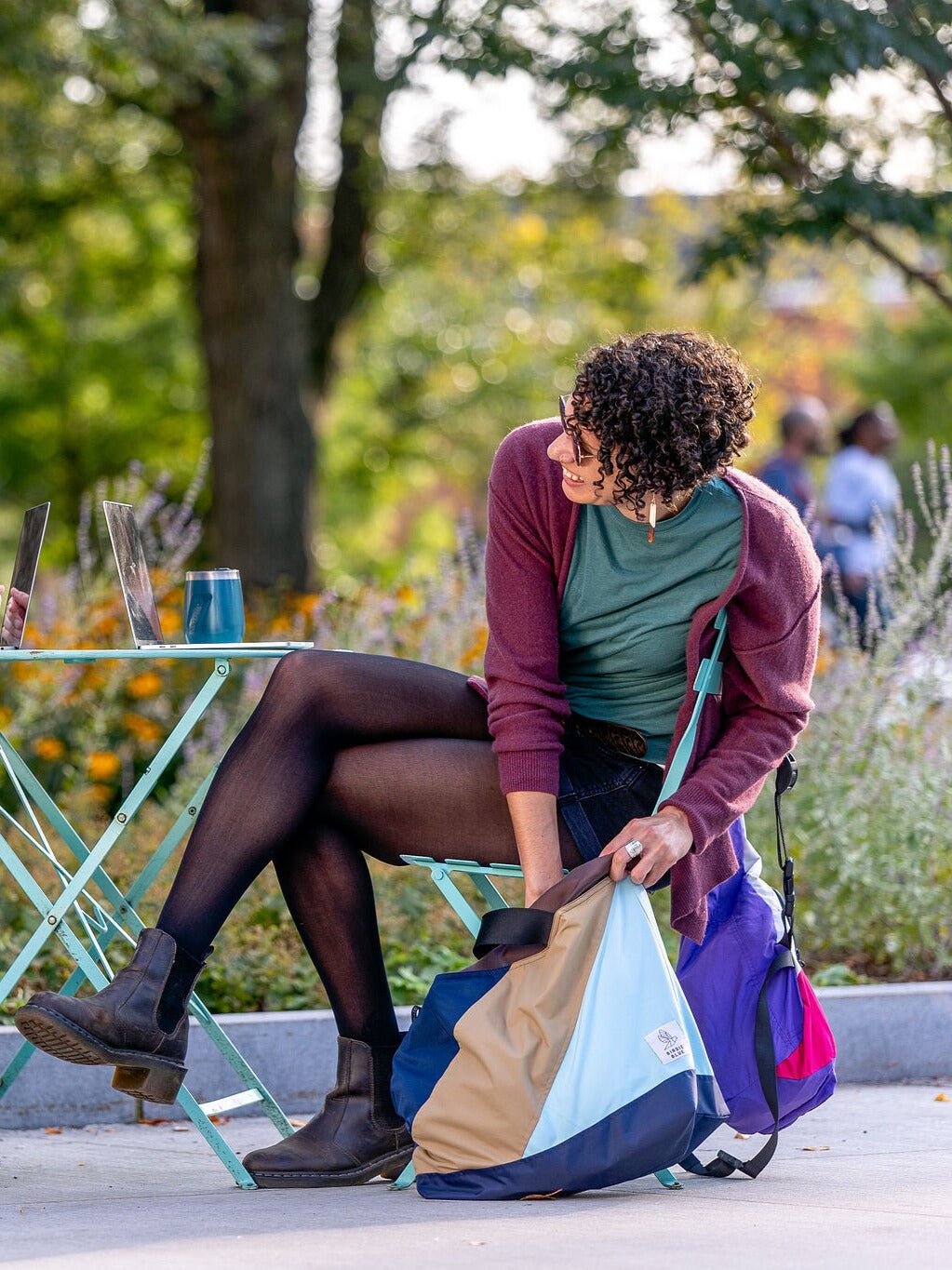 Lifestyle image of a person utilizing our Carry All sustainable bag.